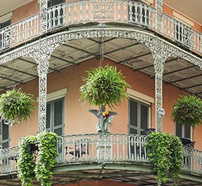 French balcony architecture on a building in the French Quarter. 