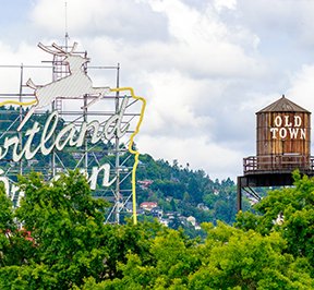 Portland, Oregon deer sign nest to Old Town water tower.