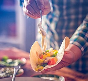 Man making a taco.