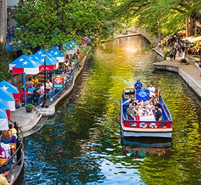 People enjoying life along San Antonio's river walk.