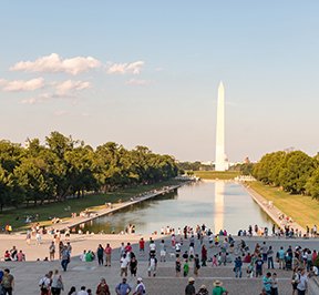 People outside looking at the Washington Monument. 