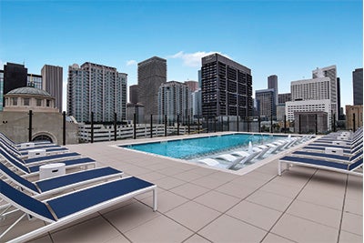 Beautiful outdoor pool with a view of the downtown Houston skyline.
